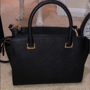 Michael Kors small bag has over the shoulder strap